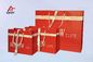 I sacchi di carta rossi di arte/il regalo carta colorata insacca il nastro bianco incollato foro medio fornitore