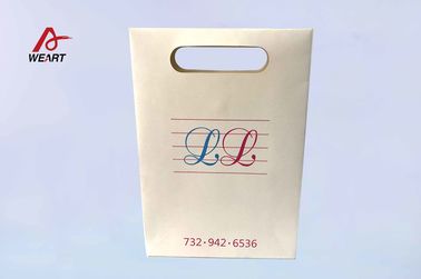 Porcellana Sacchetti della spesa opachi su ordinazione della carta della laminazione con il Bowknot della maniglia del taglio per il deposito del boutique distributore